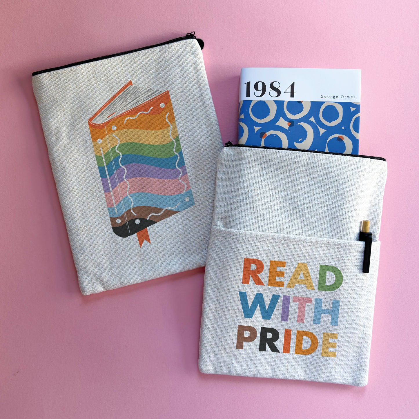 A fabric book sleeve with a Read with pride design.