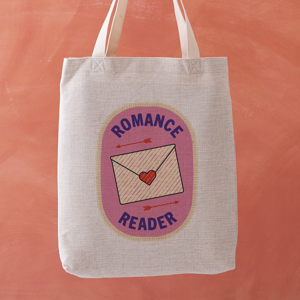 Romance Reader tote bag featuring a stitched badge-style design with a love letter and arrows on a soft pink background.