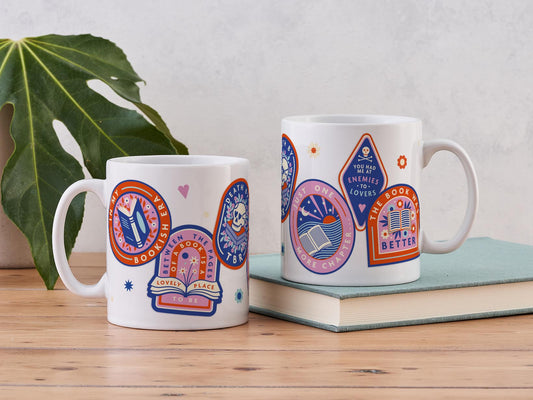 Mug with 6 bookish sticker designs on it.