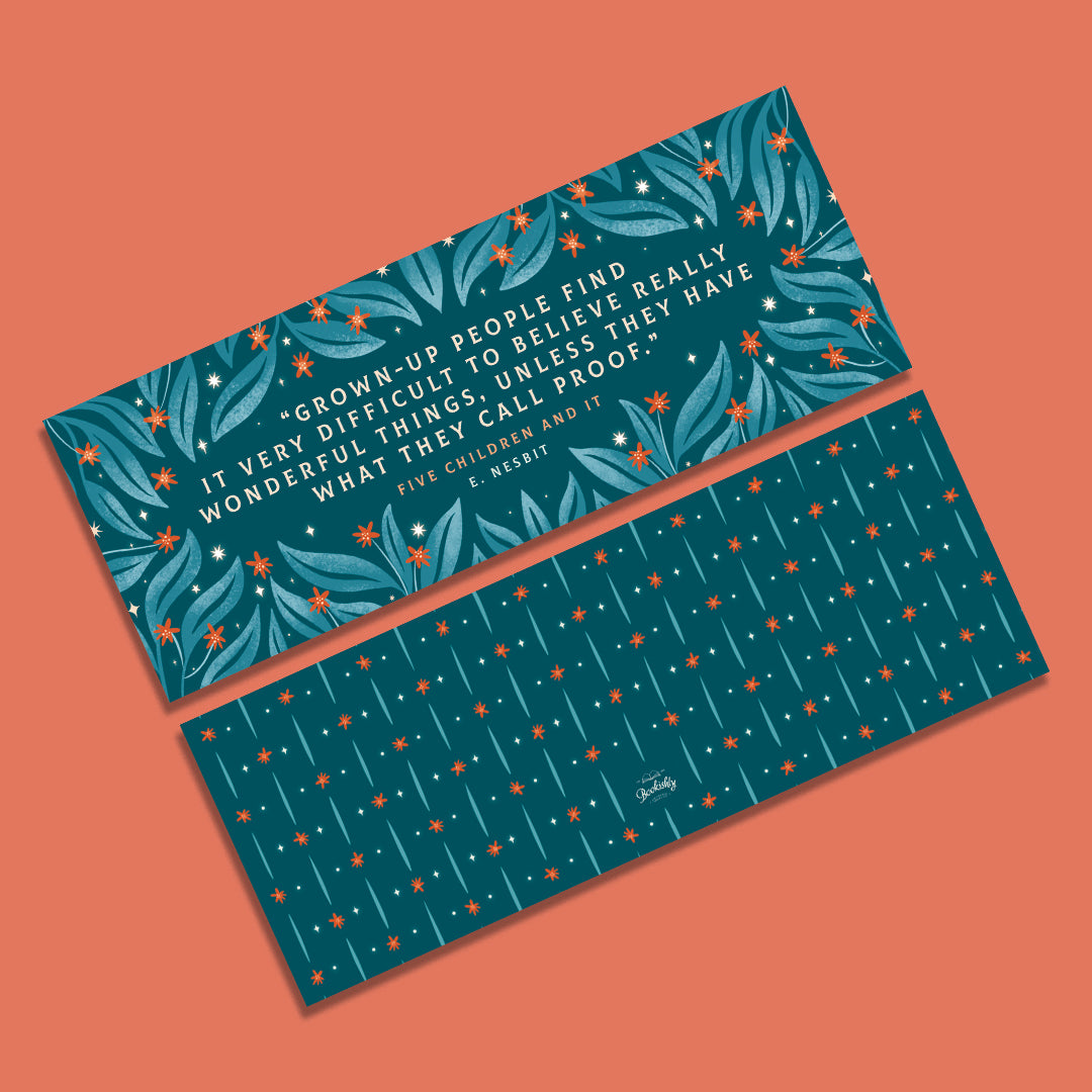 A bookmark with a quote from the book Five Children and it.  Featuring a leaf and lower design.