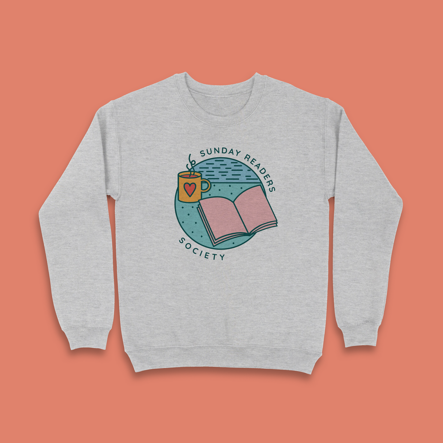 Grey sweatshirt with “Sunday Readers Society” design featuring open book and mug illustration.
