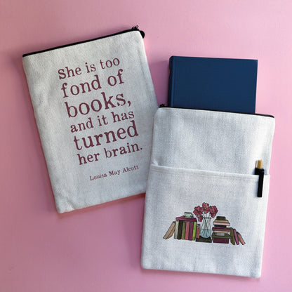A book sleeve featuring a quote from Louisa May Alcott with a bookstack design on the other side.