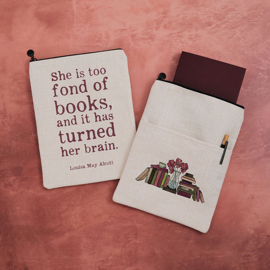 A book sleeve featuring a quote from Louisa May Alcott with a bookstack design on the other side.