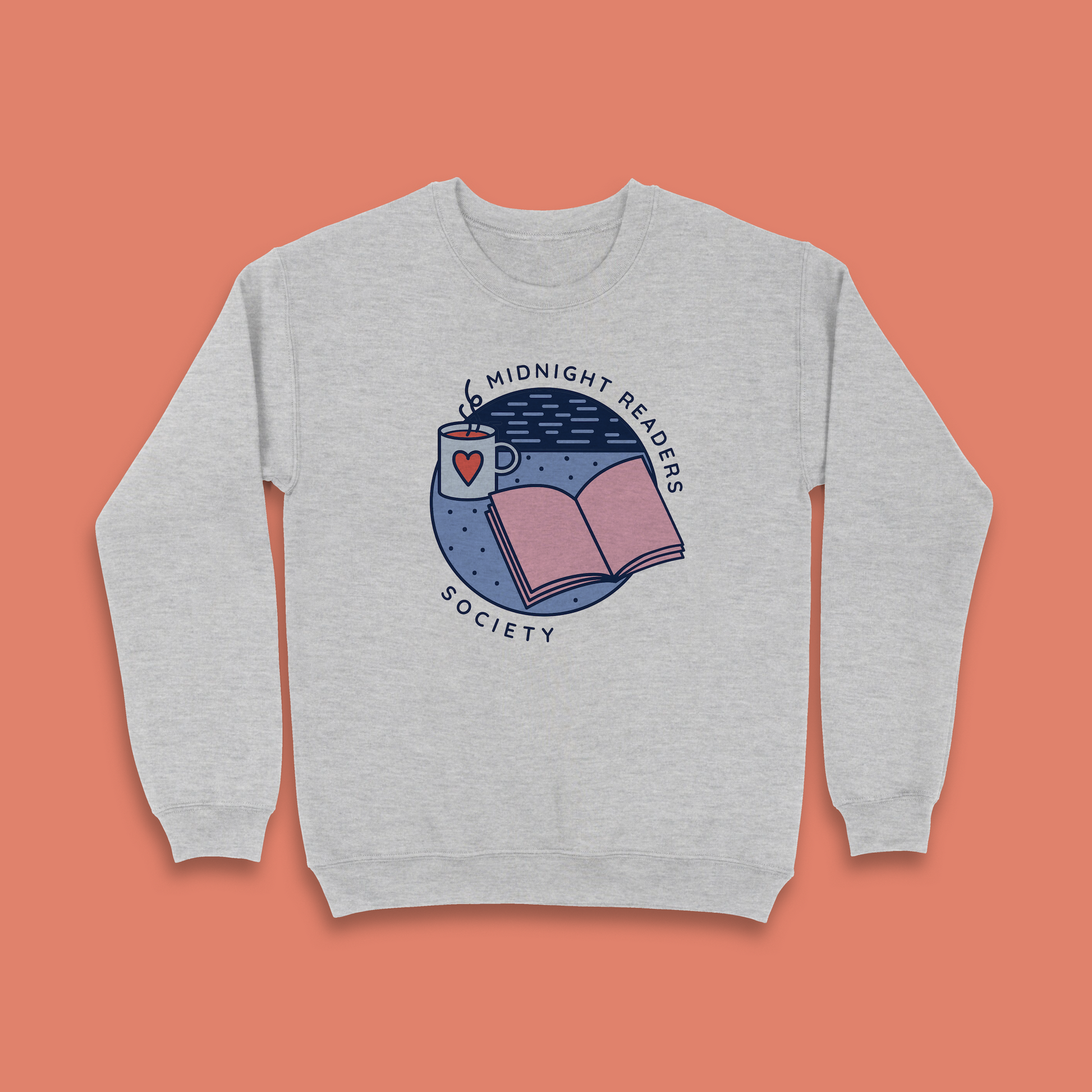 Grey sweatshirt with “Midnight Readers Society” design featuring open book and mug illustration.
