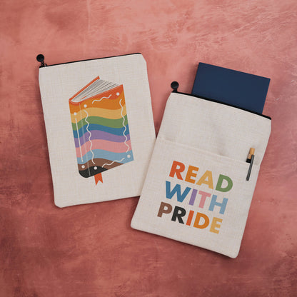 A fabric book sleeve with a Read with pride design.